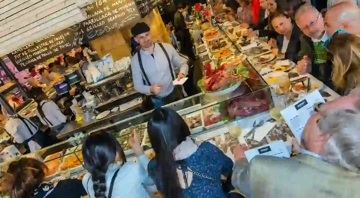 Bar restaurant serving tapas and traditional dishes at Boqueria market, Barcelona