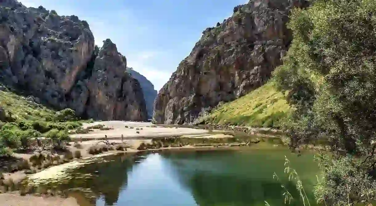 Hike from the isolated village of Sa Calobra to discover the towering rock formations of the Torrent de Pareis