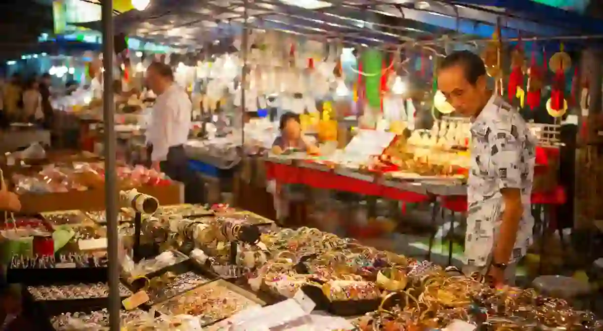 Locals shopping at Temple Street Night Market