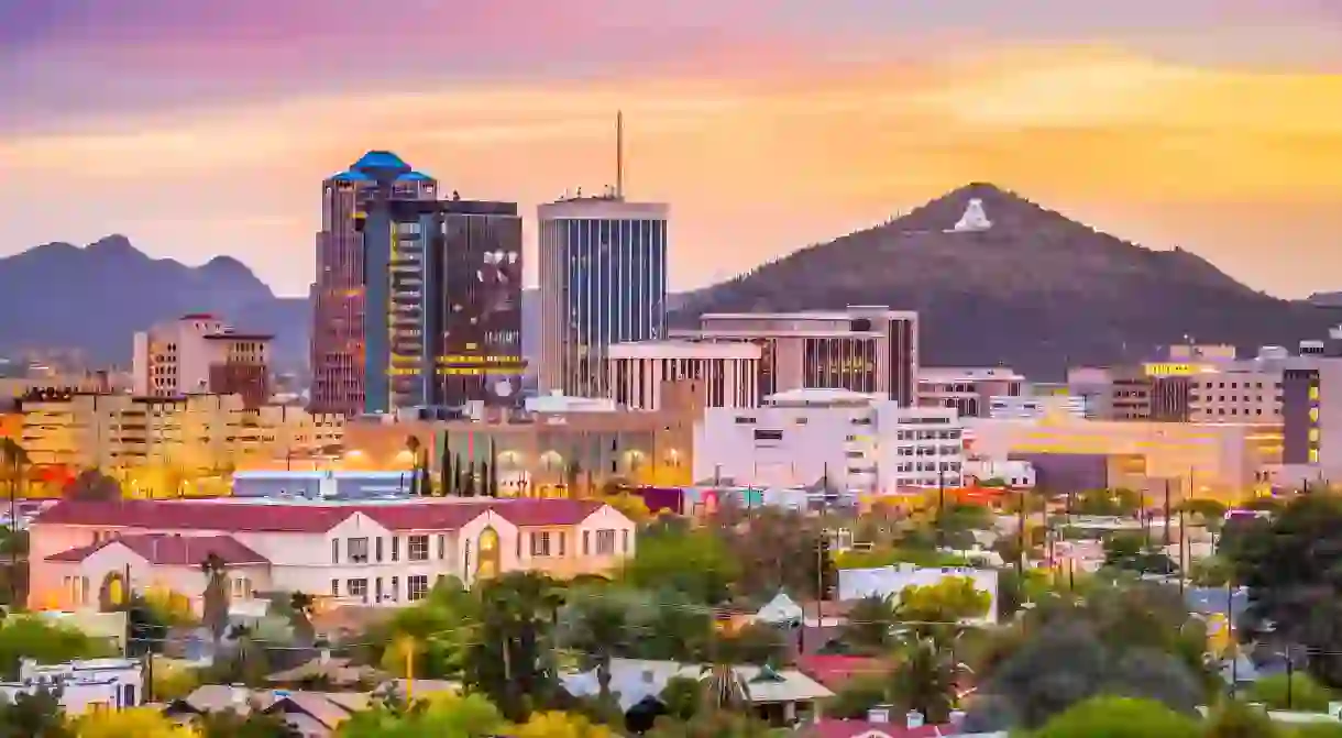 Tucson, Arizona, USA downtown skyline with Sentinel Peak at dusk