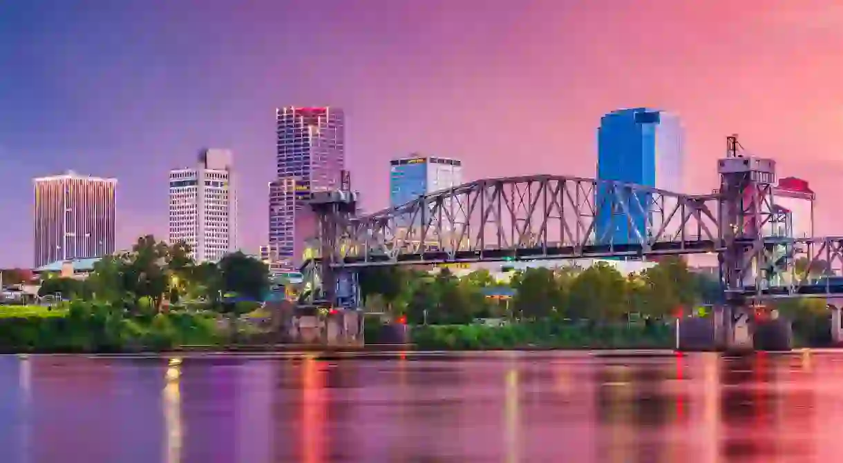 Little Rock, Arkansas, USA skyline on the river at twilight.