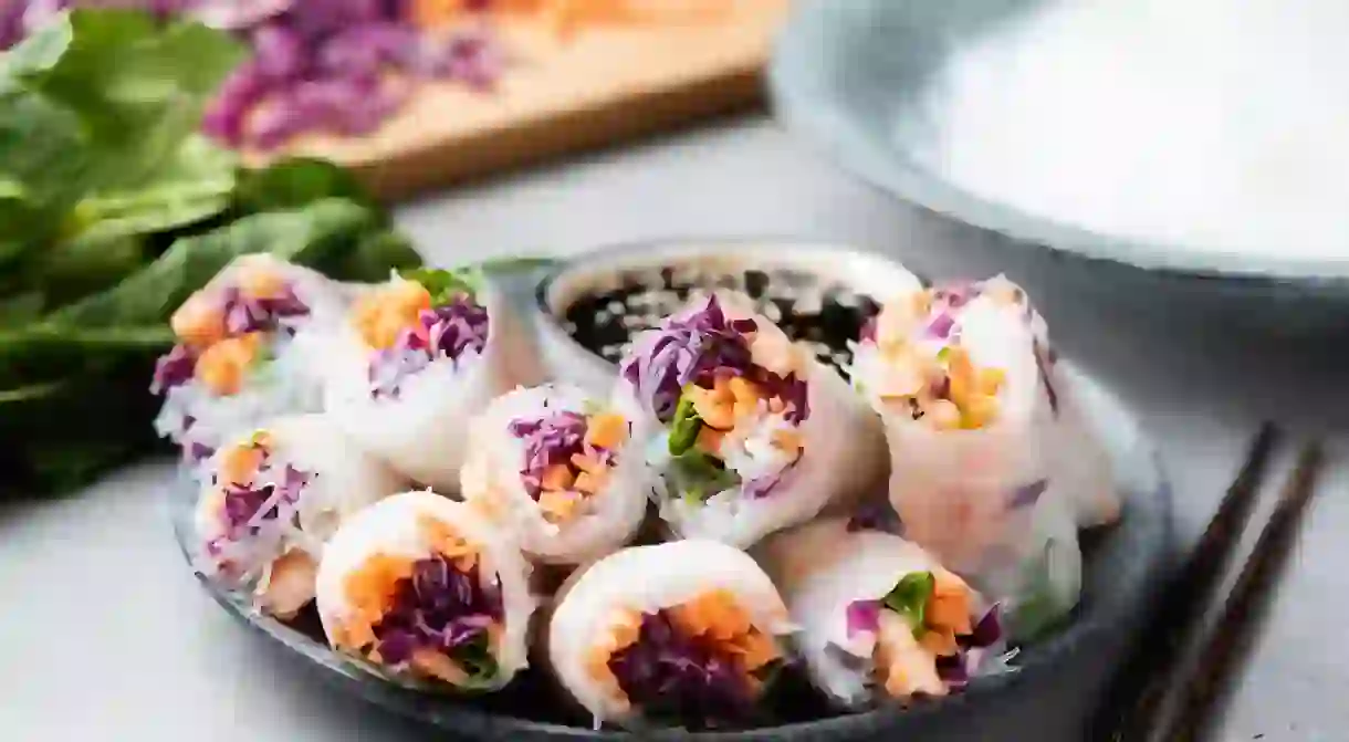 Vietnamese rice paper rolls with shrimp, red cabbage, carrot and rice noodles. Asian cuisine food. Spring rolls