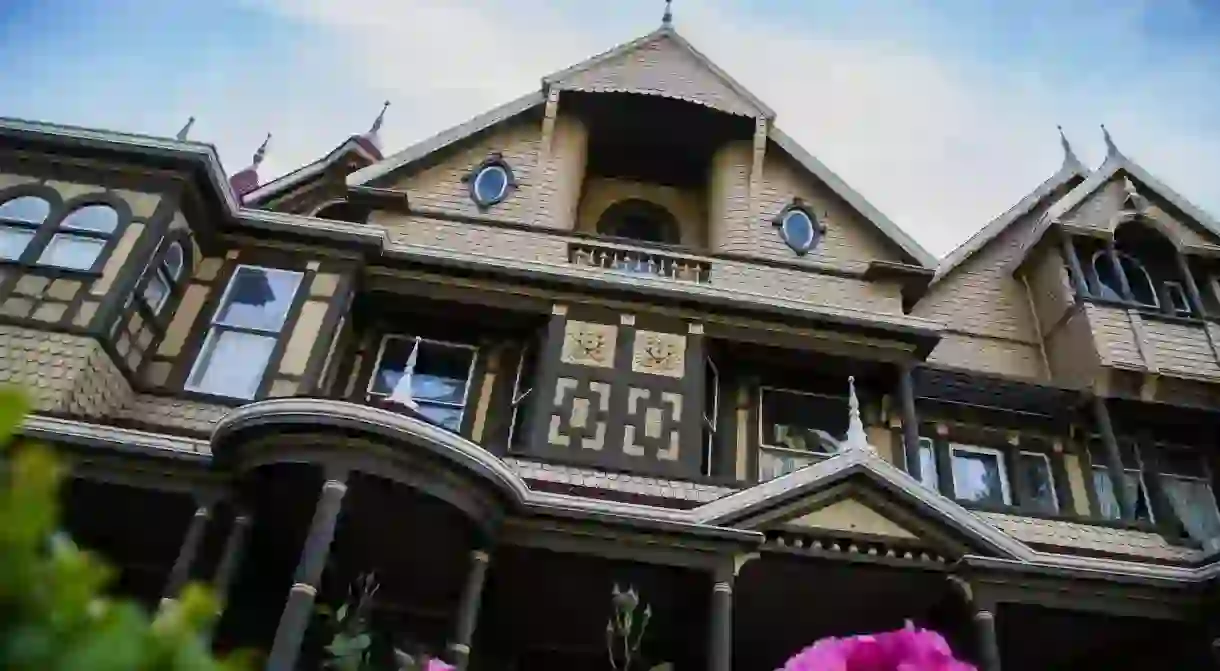 The Winchester Mystery House is one of the most famous haunted houses in the world and offers after-hours tours for the bravest of visitors