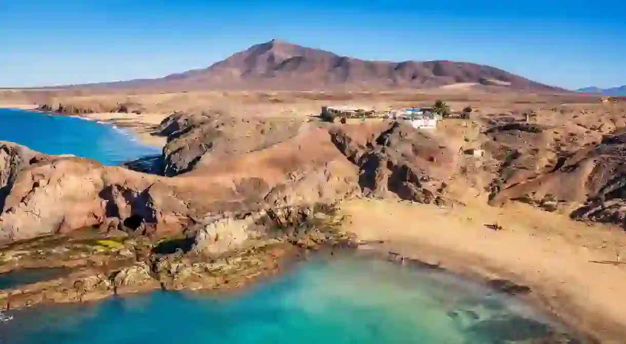 Pack a picnic and take your lunch break on Playa de Papagayo, Lanzarote