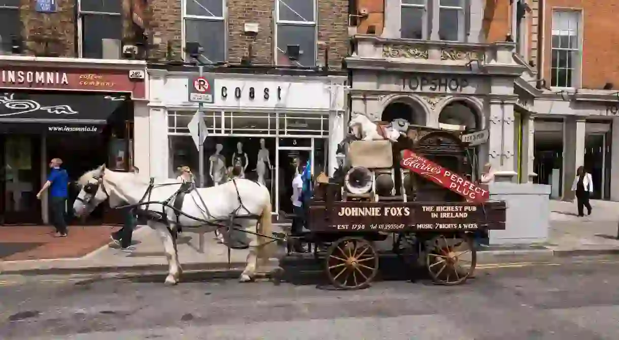 A horse and cart advertising Johnny Foxs pub in St Stephens Green, Dublin