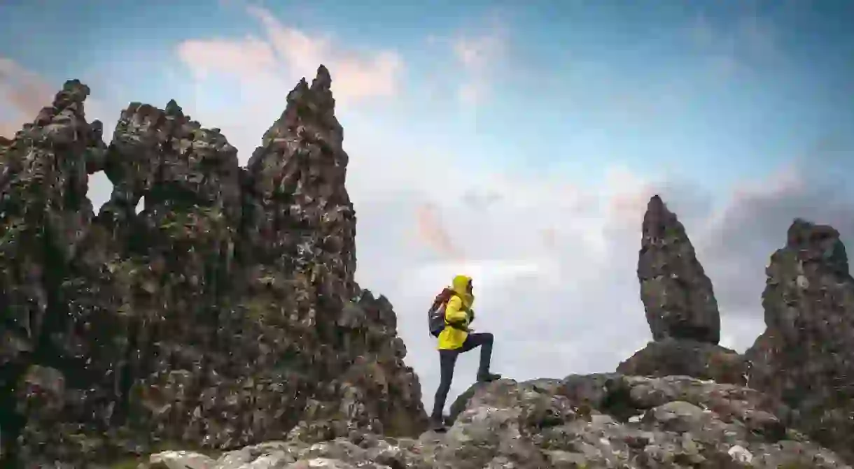 Solo traveler at Old Man of Storr in Scotland, Isle of Skye