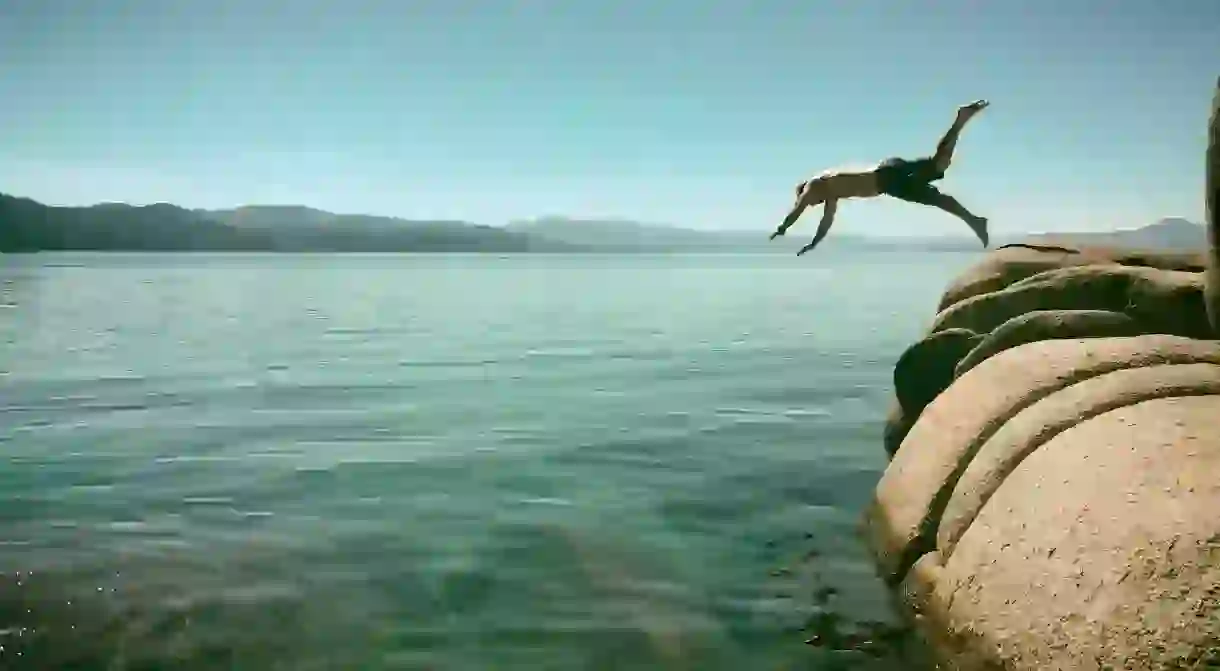 Diving off rocks into Lake Tahoe