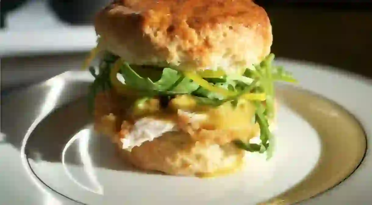 Breakfast scratch-made buttermilk biscuit with fried chicken and honey mustard