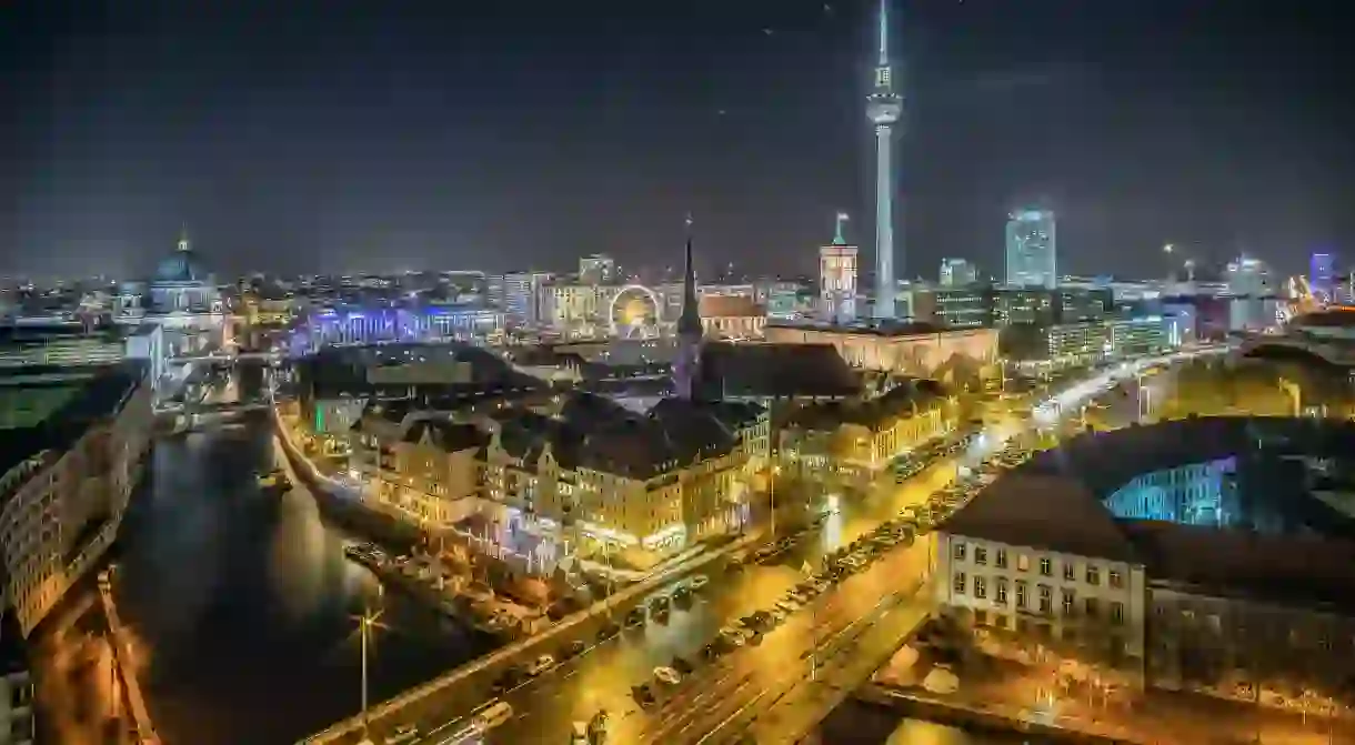 View over the River Spree to Nikolaiviertel and Alexanderplatz. The Nikolaiviertel is the reconstructed historical heart of the German capital Berlin. The neighbourhood was named after Nikolaikirche (Saint Nicholas Church).