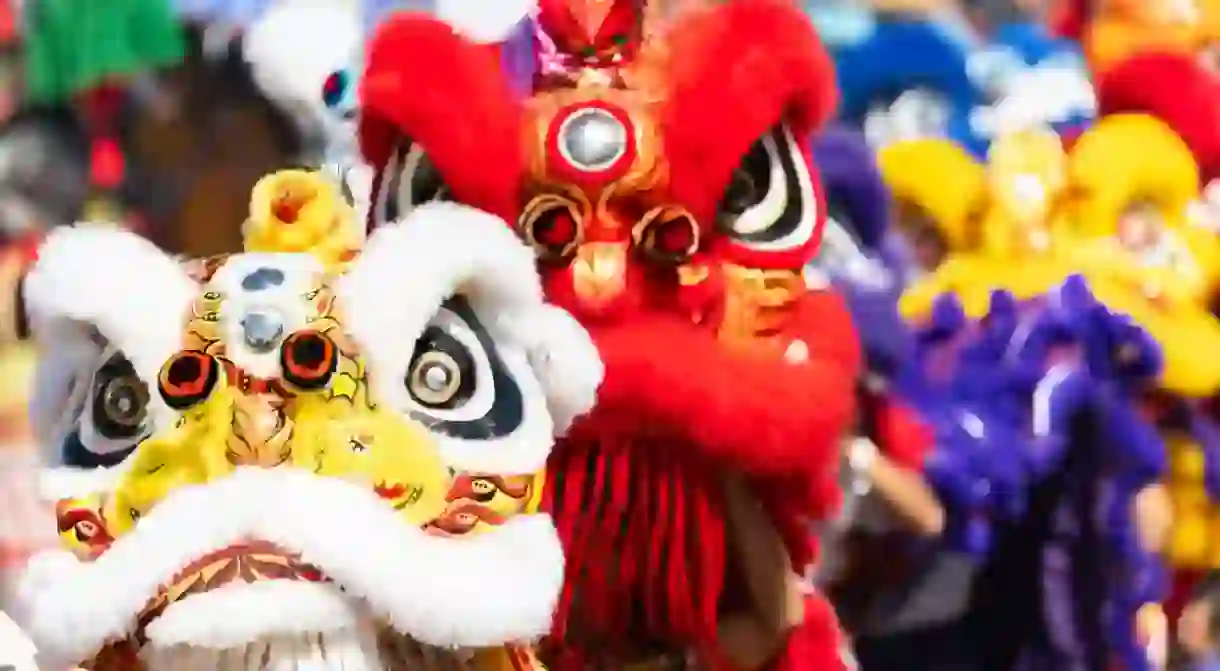 Chinese lion dance show on street in the Chinese New Year festival