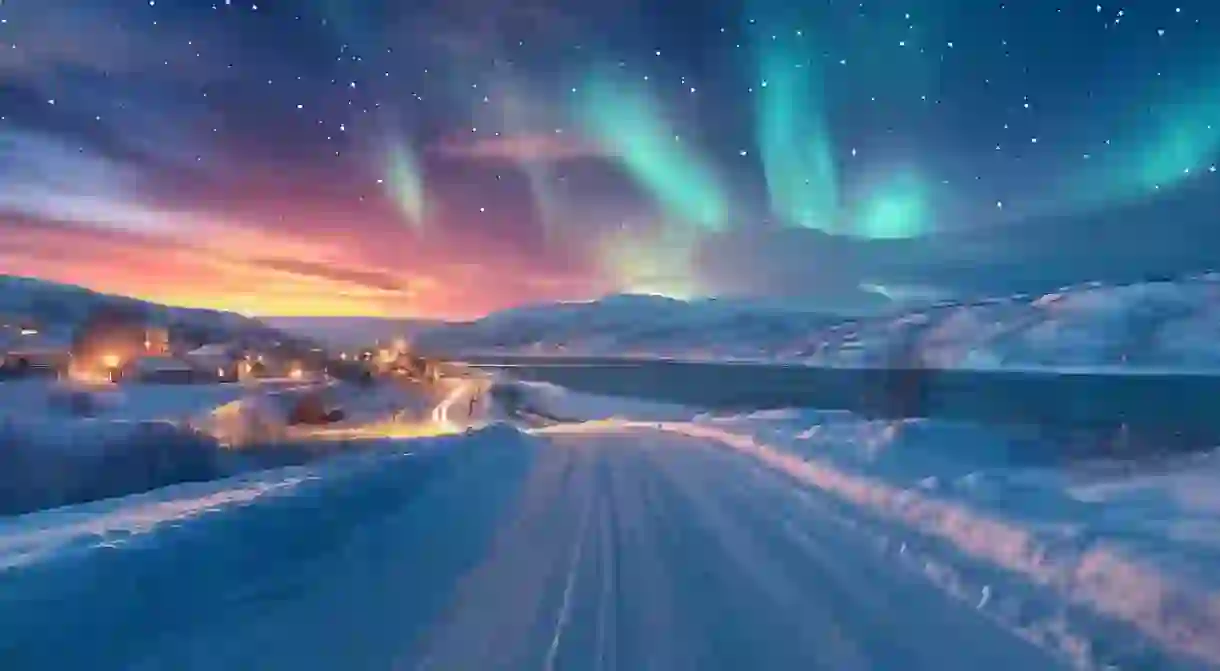 aurora borealis, northern lights over the village and mountains Abisko Kiruna