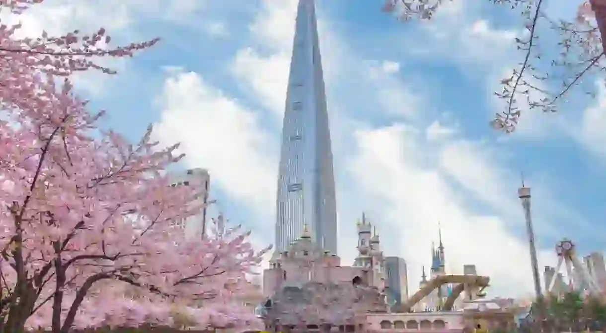 Lotte World Amusement Park and Seokchon Lake in Spring Cherry blossoms bloom in late March-April. Seoul, South Korea