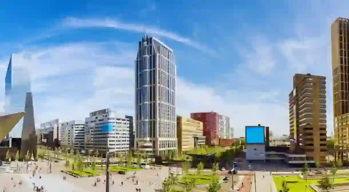 A dynamic image of Rotterdam’s skyline, highlighting the city’s modern architecture and vibrant harbor. The photo captures the essence of Rotterdam’s architectural innovation and maritime activity.