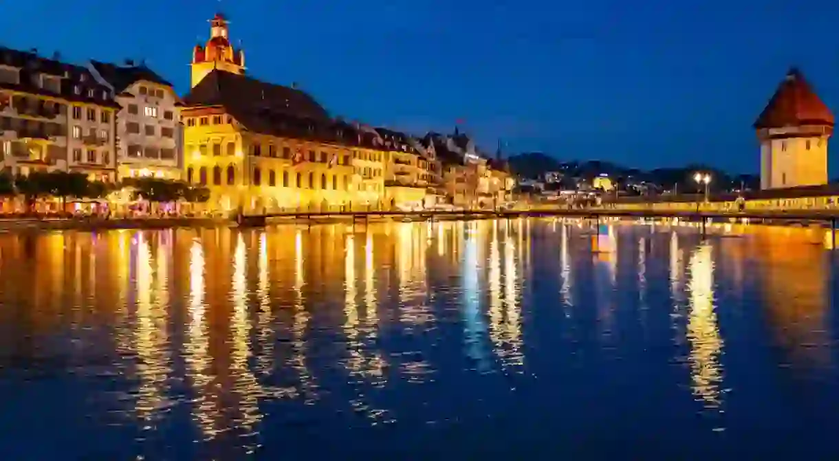 Lucern city with famous Chapel Bridge. Lucerne city view. Canton of Lucerne. Lucern Switzerland. Sunrise in historic city center of Lucerne with famous Chapel Bridge and lake Lucerne.