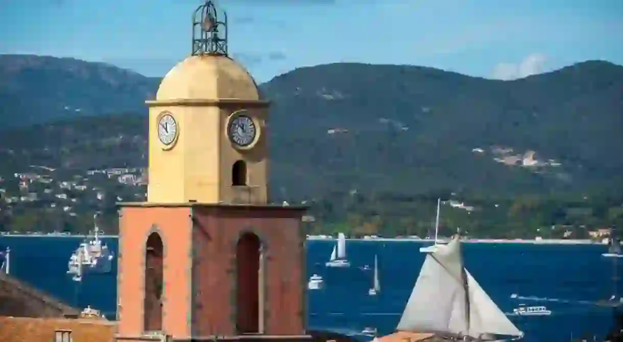 The village of Saint-Tropez with classic sailboats racing on the Mediterranean Sea photographed from the Citadel.