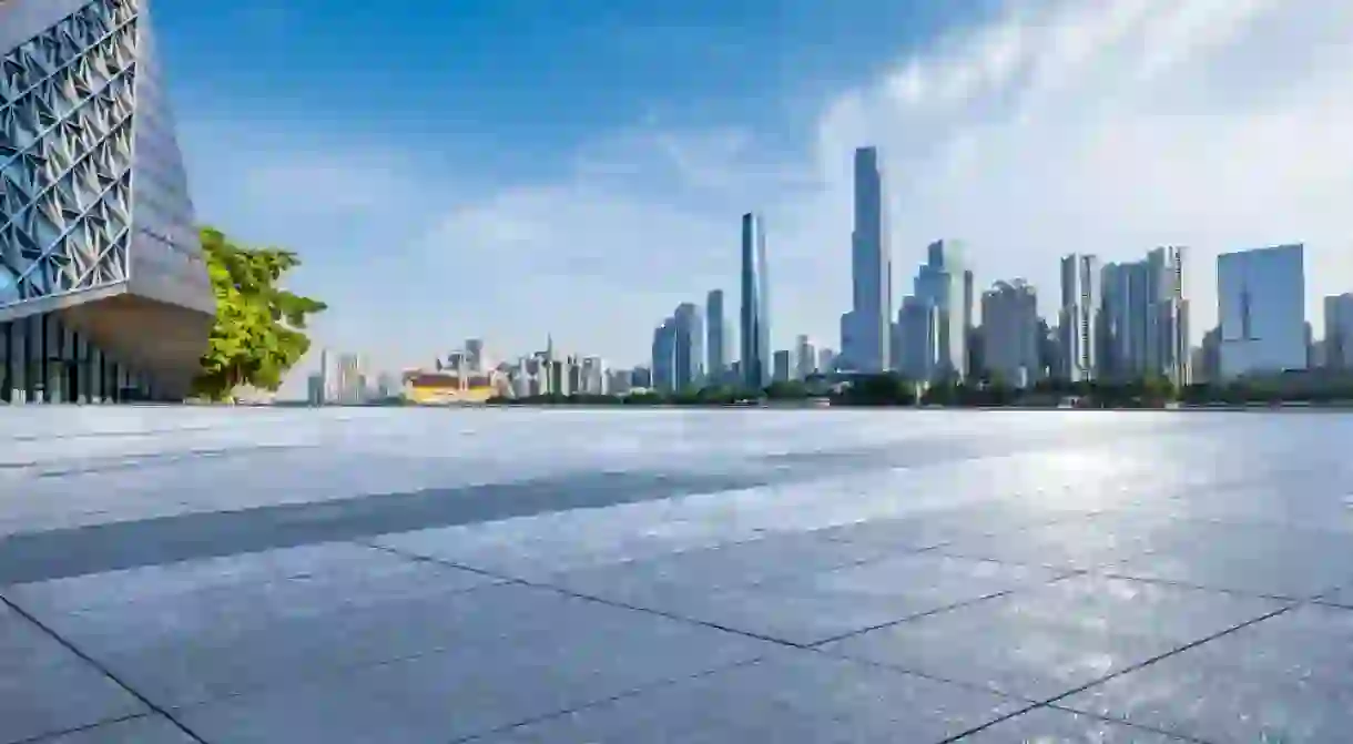 Empty square floor with modern city buildings scenery in Guangzhou. Road and buildings background.