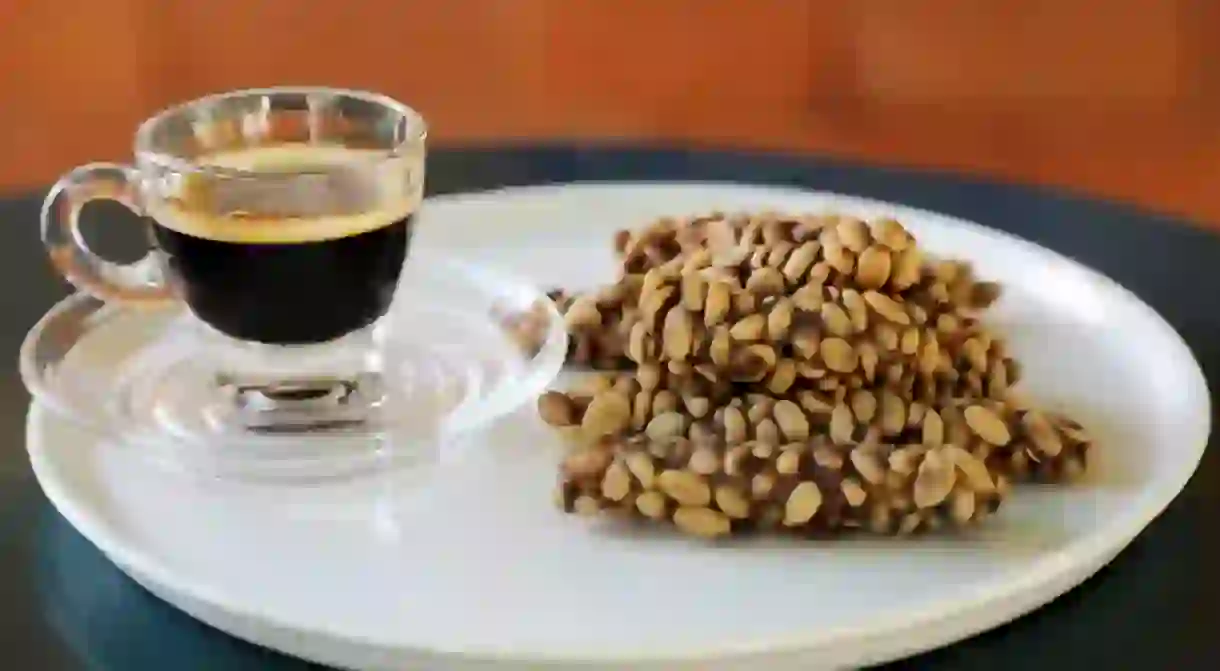 Kopi Luwak Coffee Bean or Civet coffee bean with Cup of black Kopi Luwak coffee, worlds most expensive coffee, chumphon, Thailand