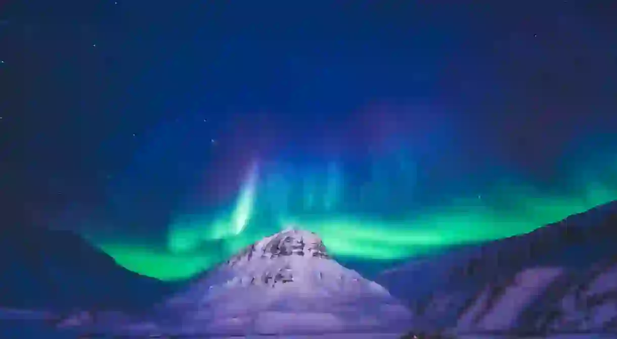 The polar arctic Northern lights hunting aurora borealis sky star in Norway