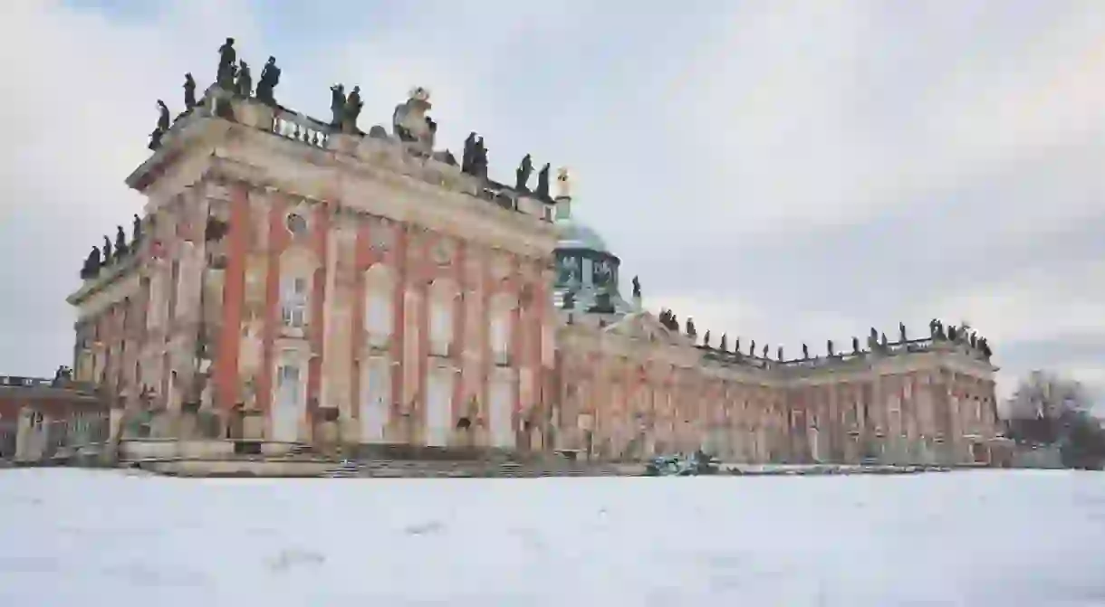 Facade of the New Palace (Neues Palais) in Sanssouci Park, Potsdam, Germany. Winter and snow.