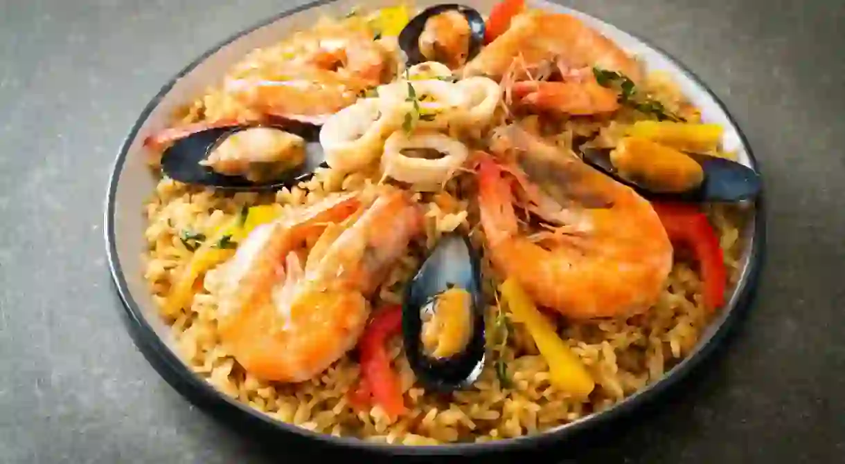 Seafood Paella with prawns, clams, mussels on saffron rice - Spanish food style