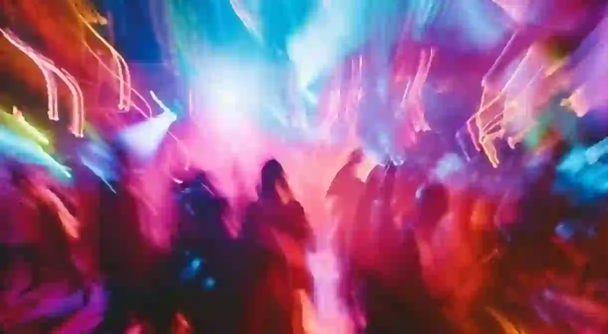 Blurred photo of people dancing in a nightclub