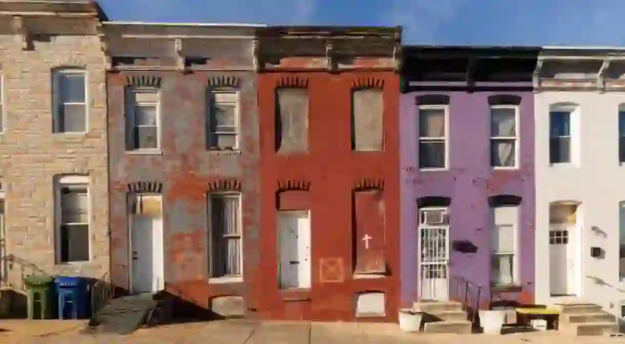 Colorful Vacant Row houses with do not enter symbols for the Fire Deparment in East Baltimore