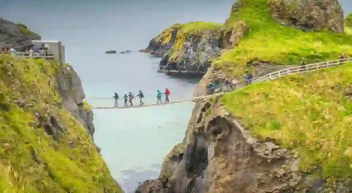 Carrick a Rede rope bridge and scenic island surrounded by turquoise Atlantic Ocean, Wild Atlantic Way