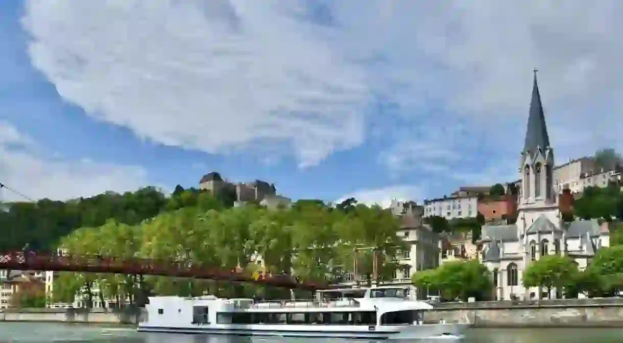 Nice boat of tourists on the river Saône