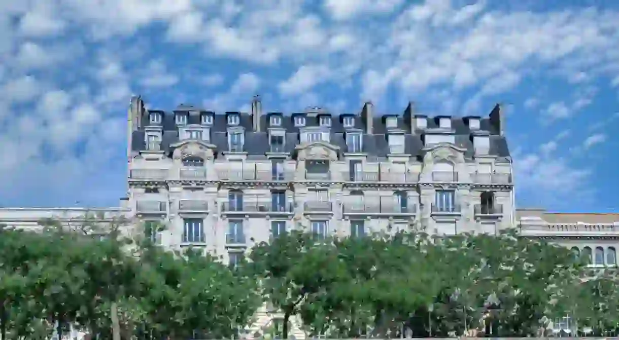 Paris, Bastille, beautiful harbor with houseboats, and typical facade in background