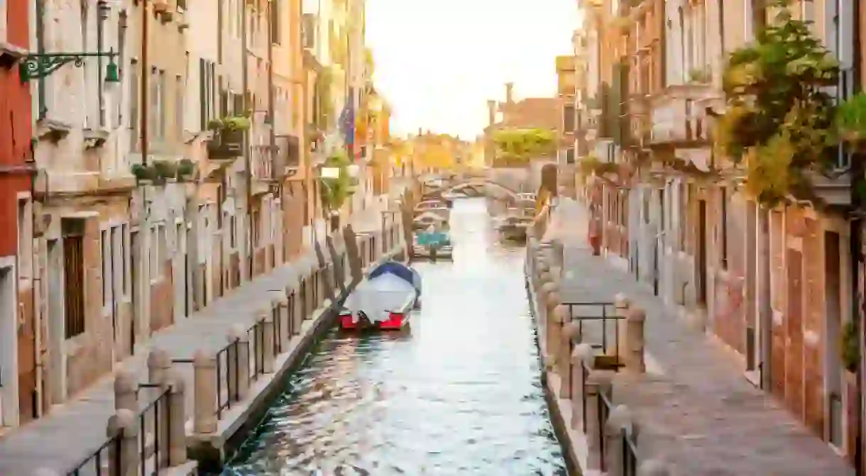 Small romantic water canal in Dorsoduro region in Venice