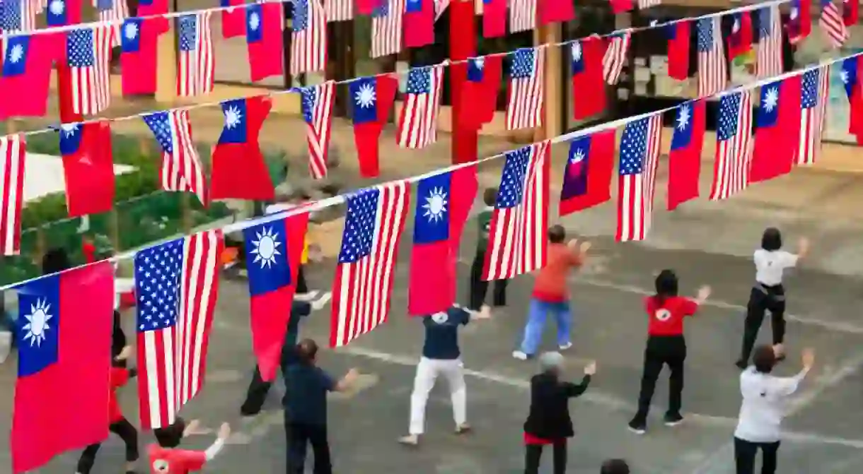 Members of the Hawaii Tai Chi Association practice Tai Chi in Chinatowns Cultural Plaza.