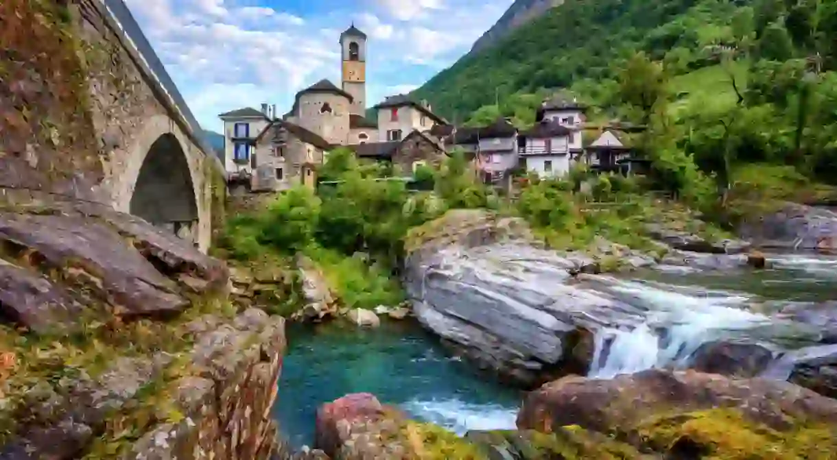 Traditional stone houses and a Church in the picturesque Lavertezzo village, Ticino, Switzerland.