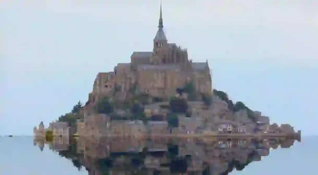 famous abbey of mont saint michel in the north of france at high tide