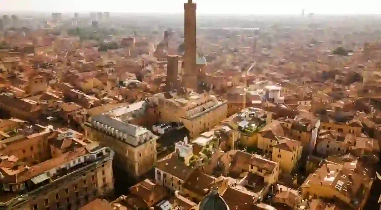 Aerial drone view of Bologna city and the two towers in the middle early in the morning