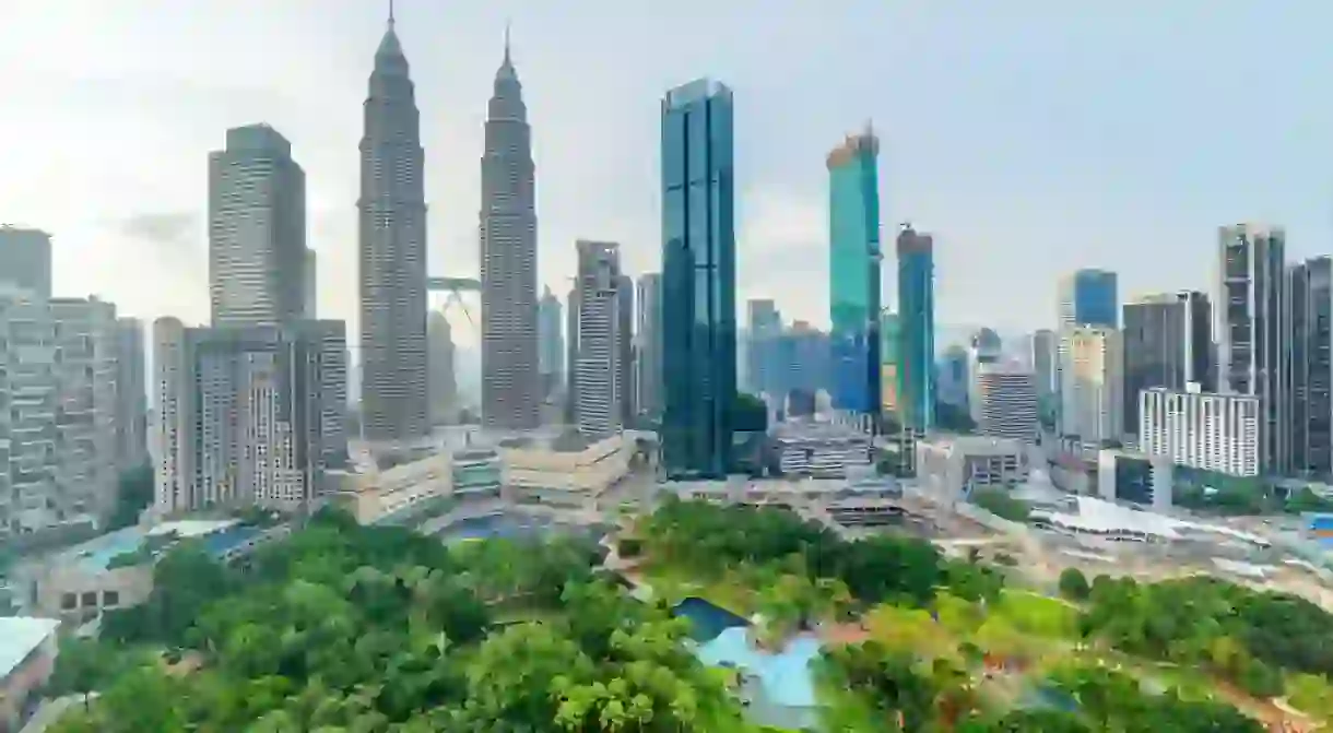 Aerial view of a green city park in Kuala Lumpur, Malaysia.