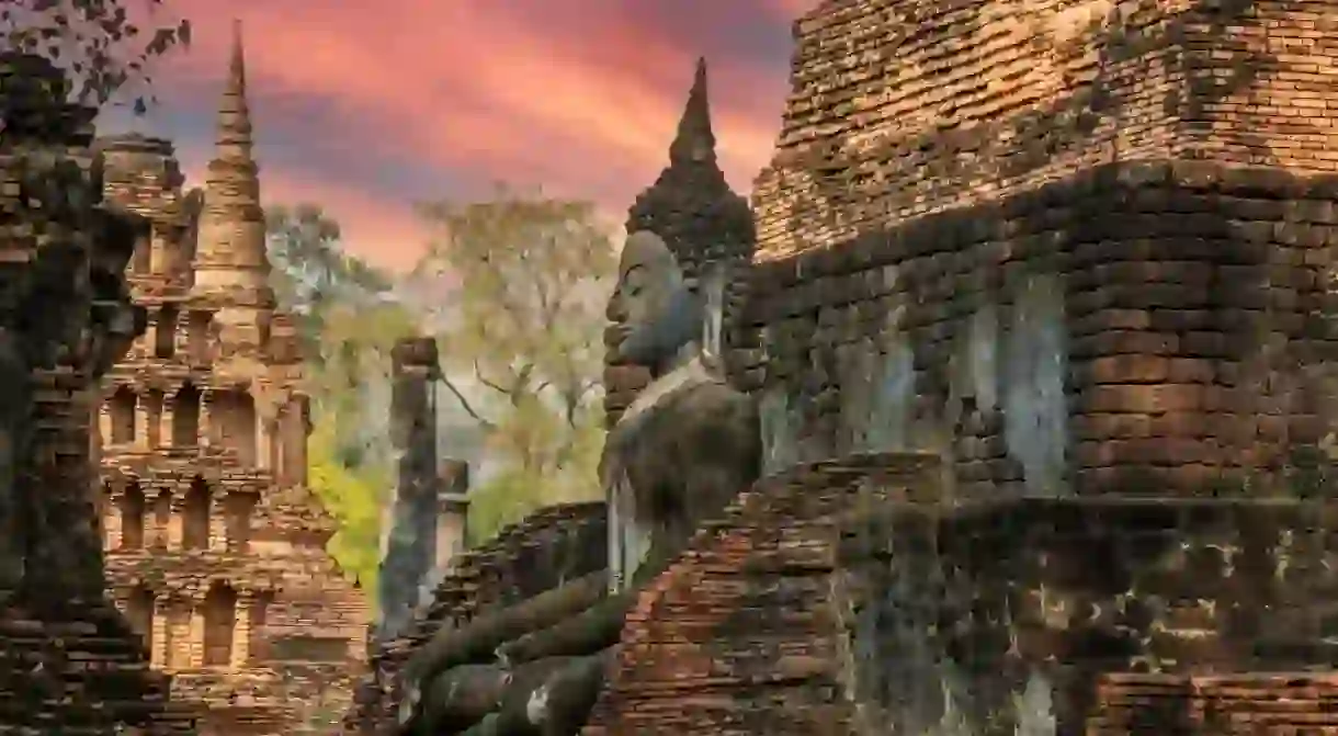 Sukhothai Wat Mahathat Buddha statues at Wat Mahathat ancient capital of Sukhothai Thailand