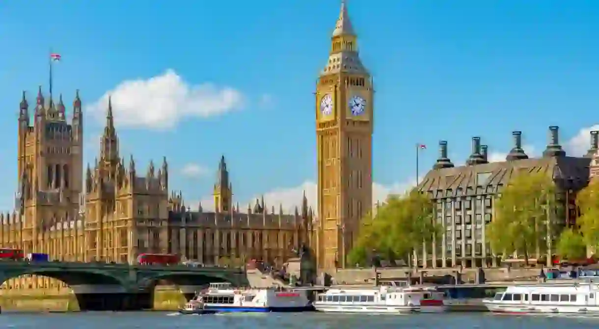 Big Ben tower of Houses of Parliament and Westminster pier, London, UK