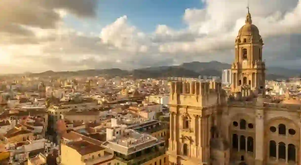 Malaga cityscape with beautiful Cathedral of the incarnation at sunset, Spain.