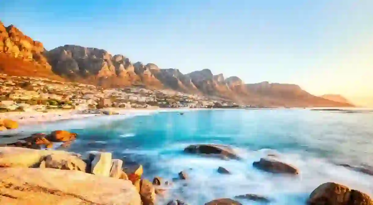 Cape Town Sunset over Camps Bay Beach with Table Mountain and Twelve Apostles in the Background, South Africa