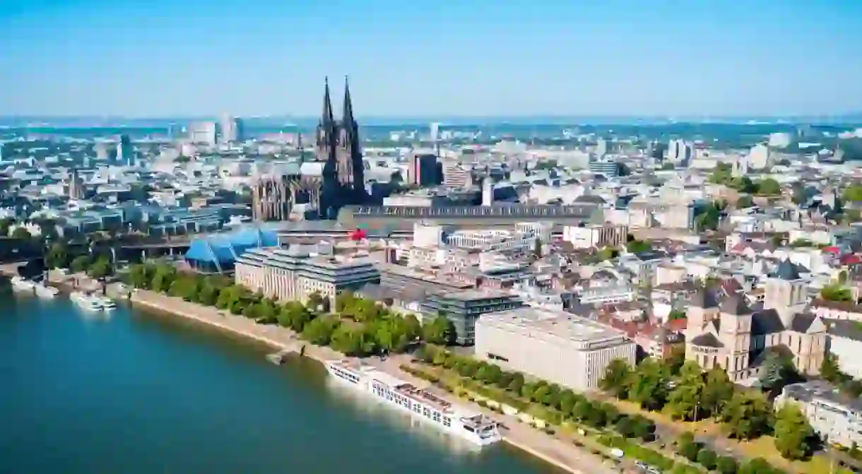 Cologne Cathedral and Hohenzollern Bridge through Rhine river aerial panoramic view in Cologne, Germany