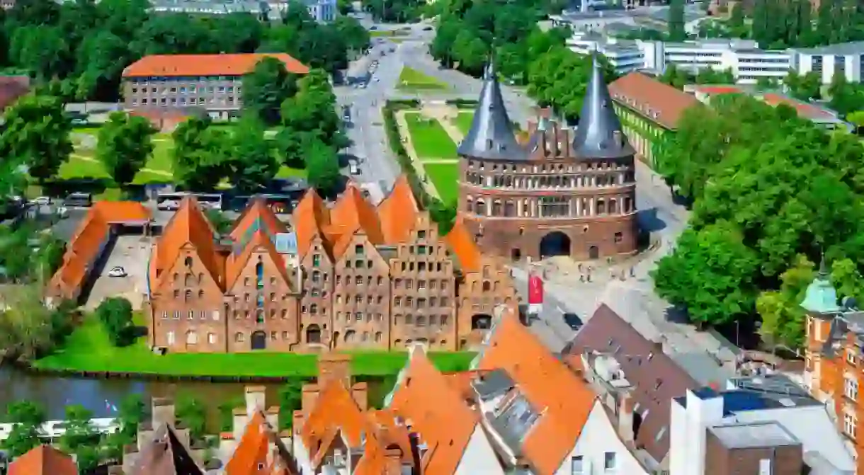 View of the historic town of Lubeck with famous Holstentor gate in summer, Schleswig-Holstein, Northern Germany