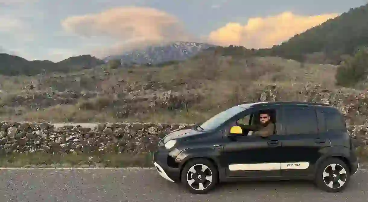 Gethin, his rented Fiat Pandino and Mount Etna herself in the background