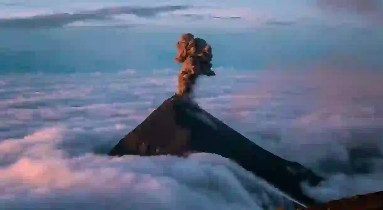 Volcan de Fuego in Guatemala erupting at sunrise seen from Acatenango Summit