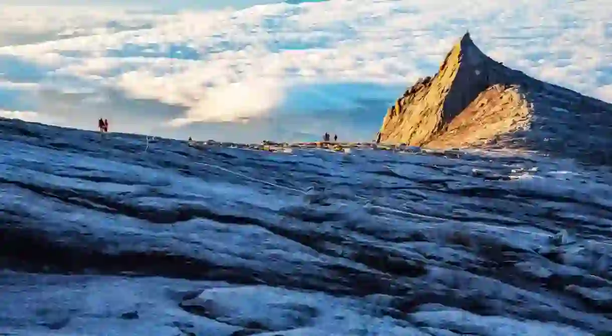 Mount Kinabalu peak with light of sunrise on Mount trip travel, hiking in Kinabalu national park.